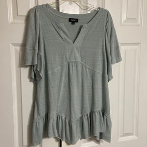 Sea foam colored women’s top. Size large, worn only once, great condition.